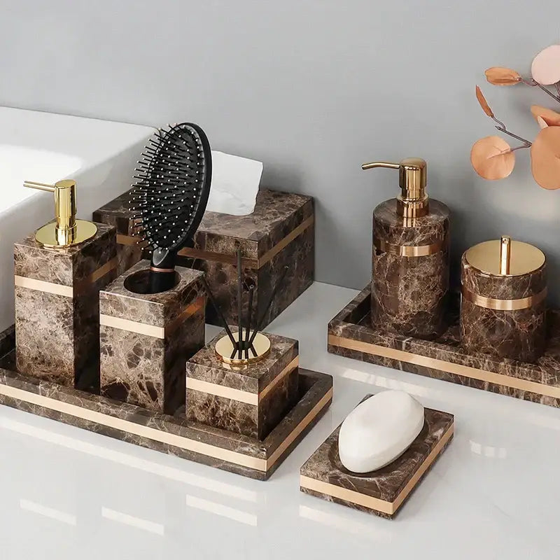 Emperador dark marble bathroom set featuring brown emperador dark marble with gold accessories and accents