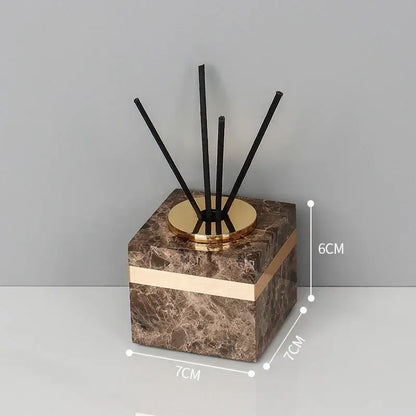 Brown emperador dark marble cube diffuser with gold-toned base and black reeds for dark marble bathroom accessories