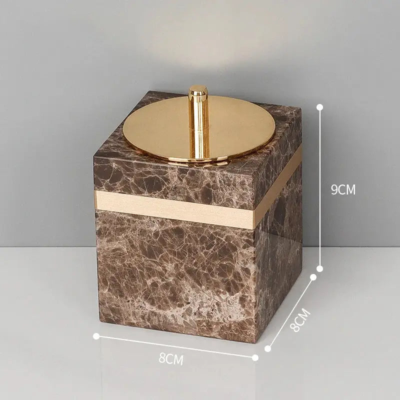 Brown emperador dark marble cube with gold-toned lid and trim from dark marble bathroom accessories set