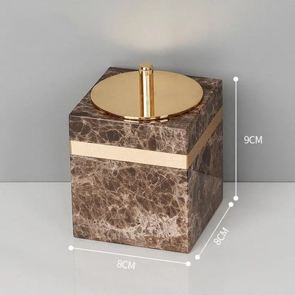 Brown emperador dark marble cube with gold-toned lid and trim from dark marble bathroom accessories set