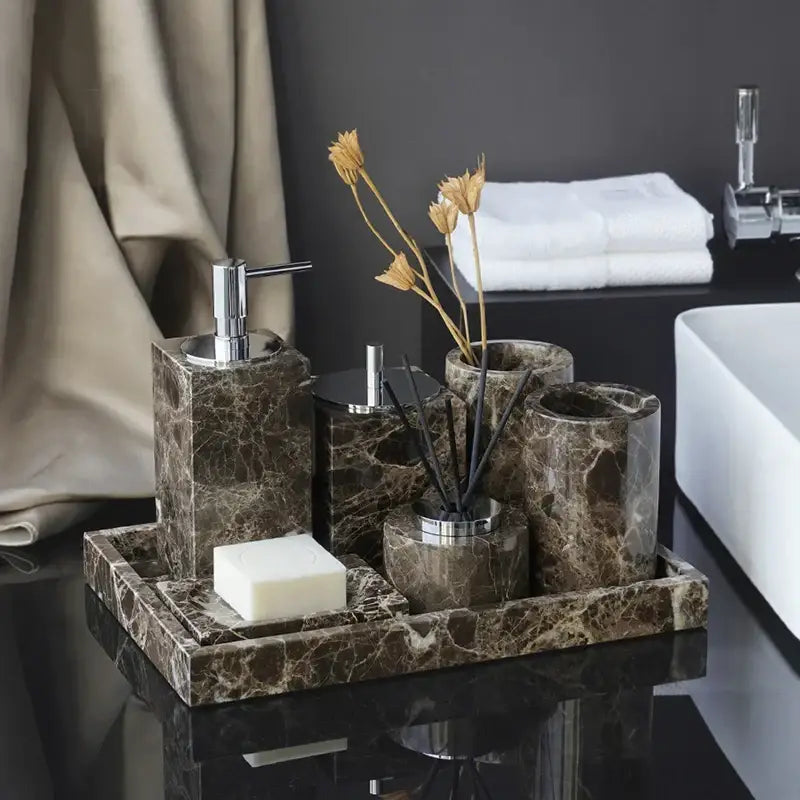 Emperador dark marble bathroom accessory set featuring brown marble with chrome tops and a matching tray
