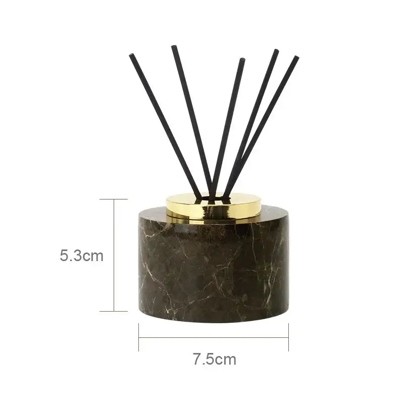 Elegant emperador dark marble reed diffuser with dark brown marble body and polished gold-toned cap for bathroom use