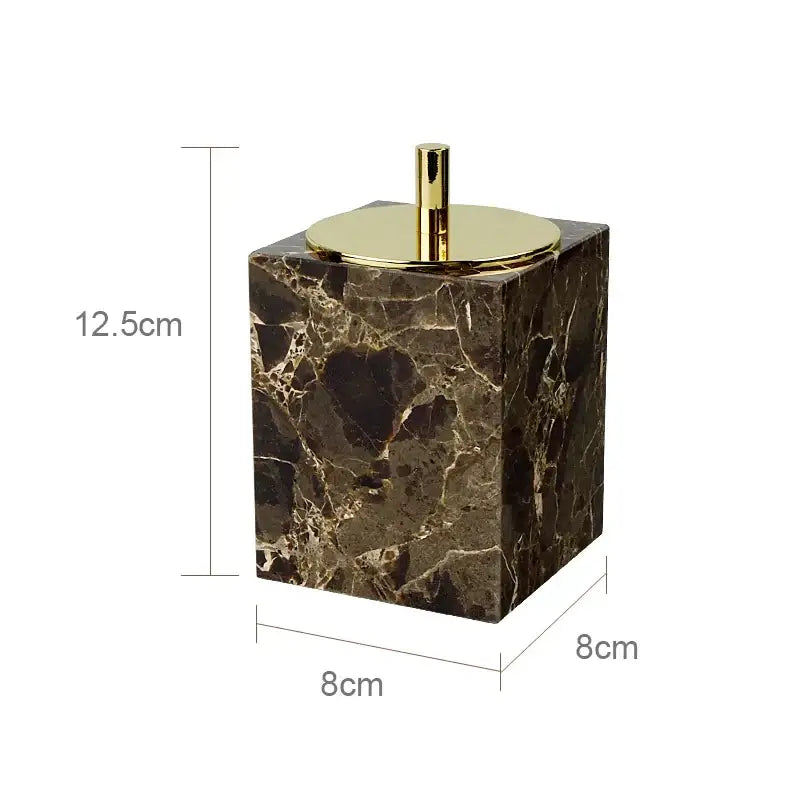 Emperador dark marble toilet brush holder in dark brown with polished gold-toned lid and central handle for bathroom use