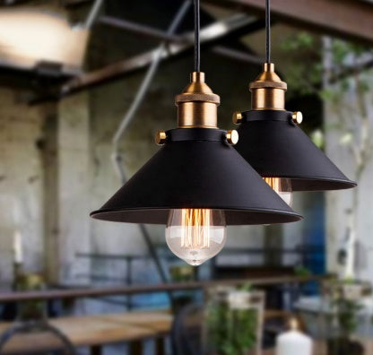 Black and gold industrial pendant light with glass bulb, modern design.