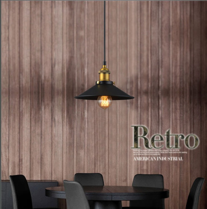 Black and gold industrial pendant light with a cone-shaped shade.