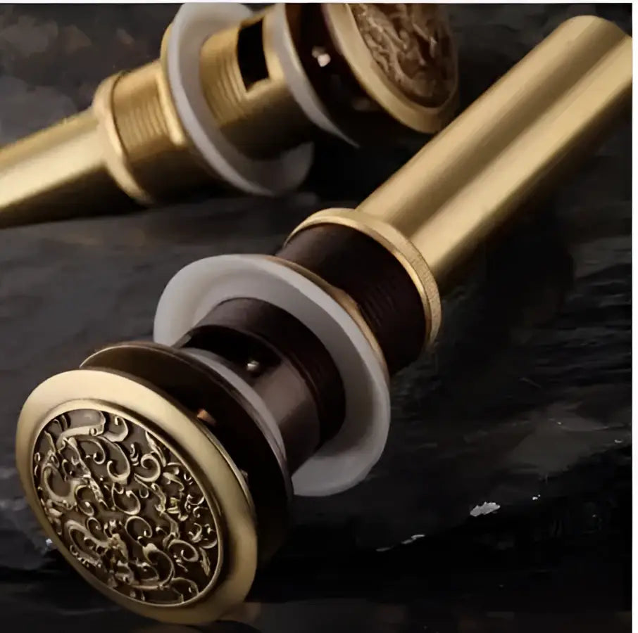 Engraved brass bathroom sink pop up drain stopper with floral design and white rubber seal for decorbites brass bathroom use