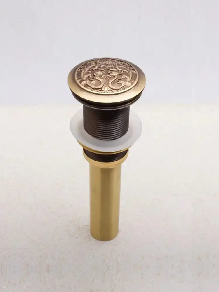 Engraved brass bathroom sink pop up drain stopper with ornate dragon and floral design for brass bathroom sink decorbites