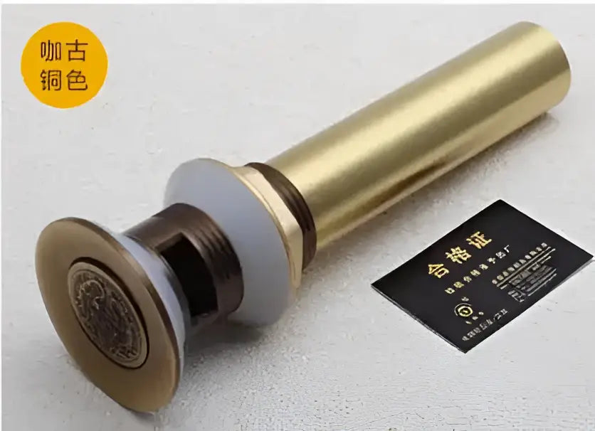 Engraved brass bathroom sink pop up drain stopper with decorative circular plate and metallic finish for brass bathroom sink decorbites