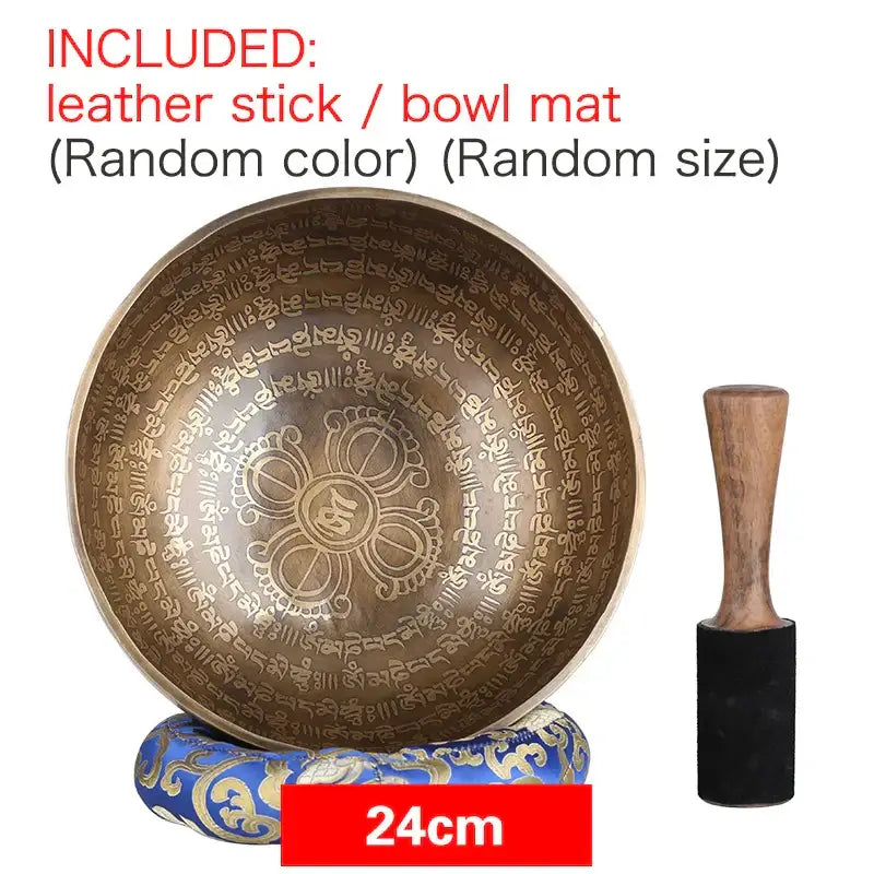 A 24cm engraved gold bronze tibetan singing bowl with sanskrit script and mandala design with wooden mallet for meditation