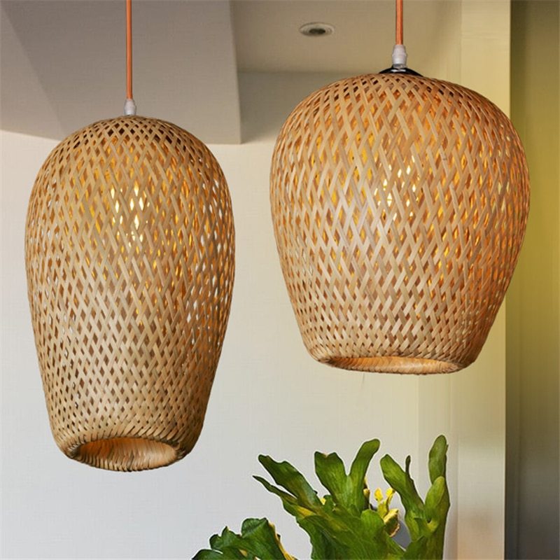 Rattan pendant light with woven texture, natural brown color and copper accents.