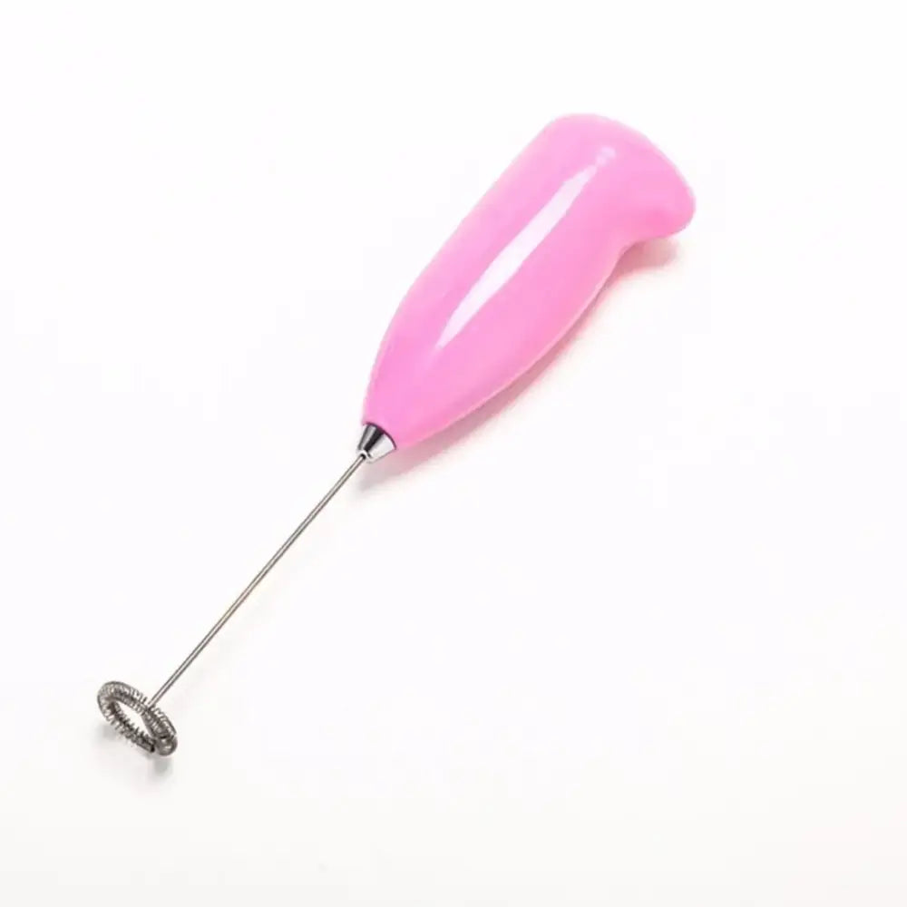 Ergonomic brown electric mini mixer frother with pink plastic handle and metallic spiral whisk for kitchen use