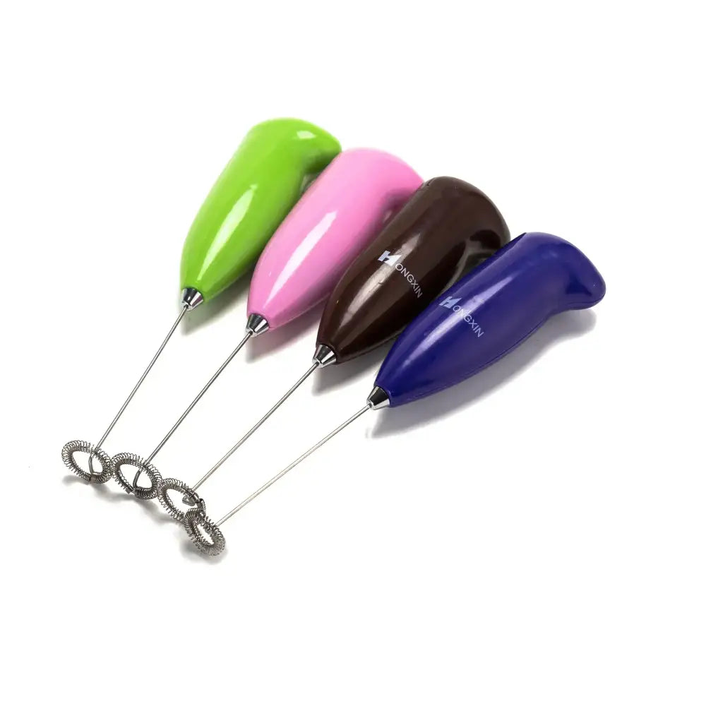 Set of four colorful electric mini mixer frothers with ergonomic glossy plastic handles in green pink brown and blue