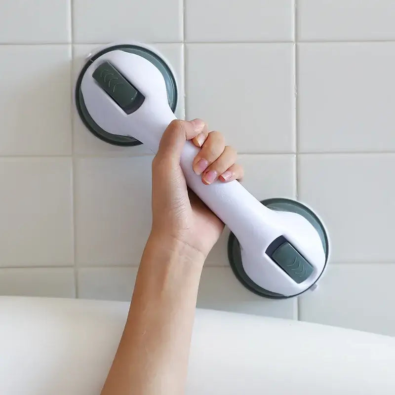 Ergonomic white and gray suction cup grab bar with comfortable handle designed as a bathroom safety handle