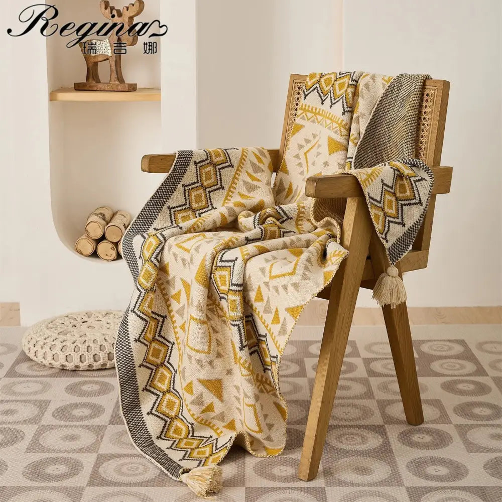 Cozy cream and mustard knit ethnic bohemian blanket with geometric patterns black tassels decorbites ethnic decor