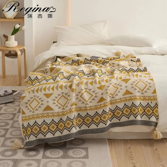 Cozy cream-colored ethnic bohemian blanket knit with geometric mustard and black patterns tassels for living room decorbites ethnic decor