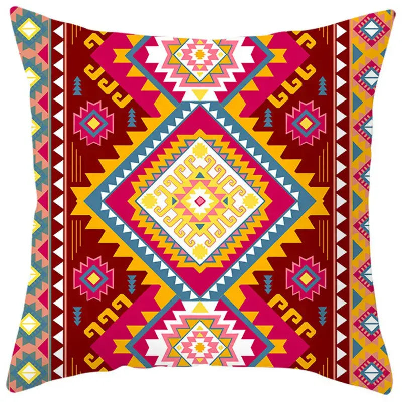 Vibrant ethnic bohemian geometric pillow cover in bold red pink yellow and teal tones for living room decorbites decor