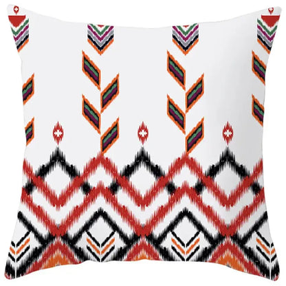 White throw pillow cover with vibrant red black orange and green ethnic bohemian geometric pattern for living room decorbites decor