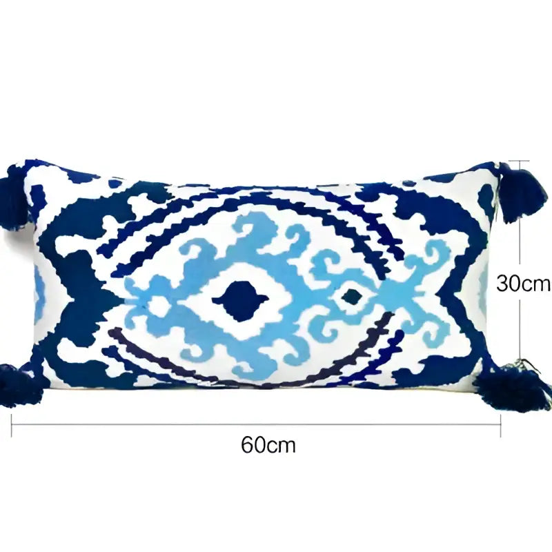 Rectangular 60cm by 30cm embroidered floral pillow cover with ethnic tassels featuring blue and white ikat pattern