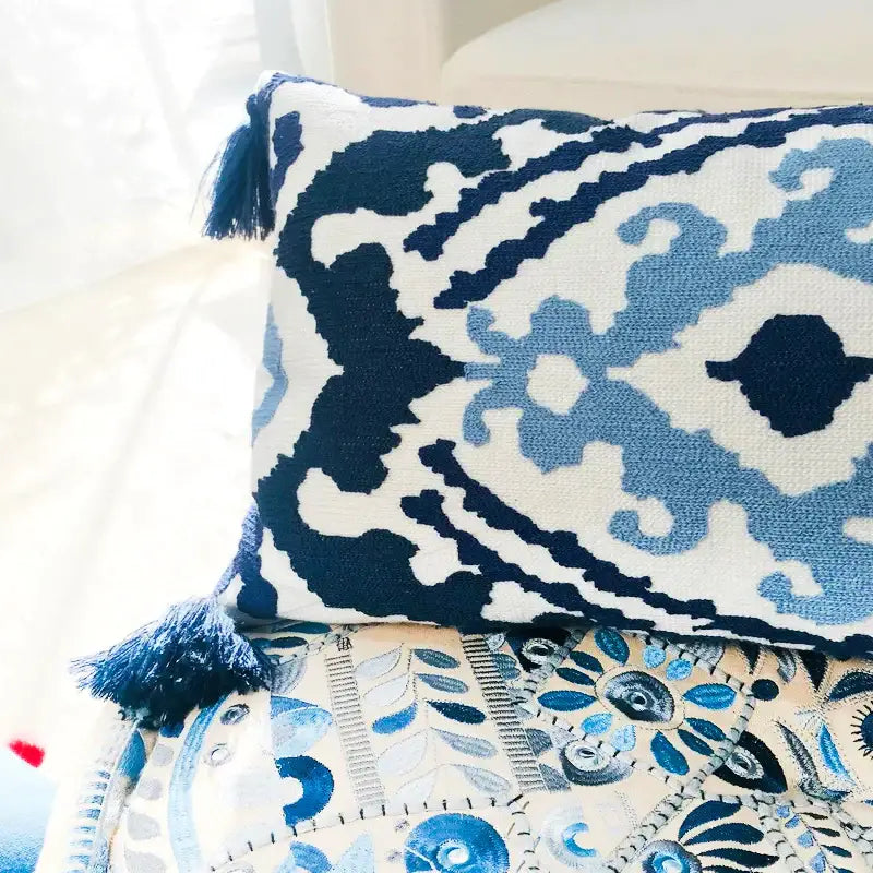 Blue and white rectangular pillow cover with embroidered floral ethnic tassels and tassels on each corner for living room decor