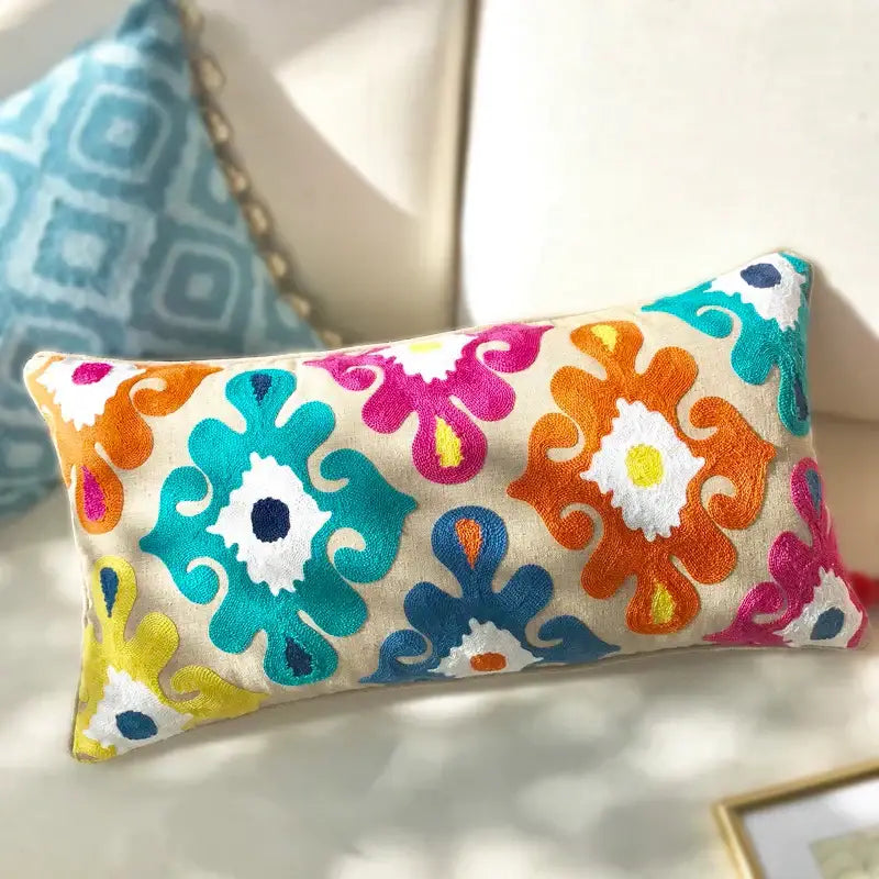 Vibrant ethnic embroidered floral pillow cover with beige base colorful patterns and tassels for living room decor