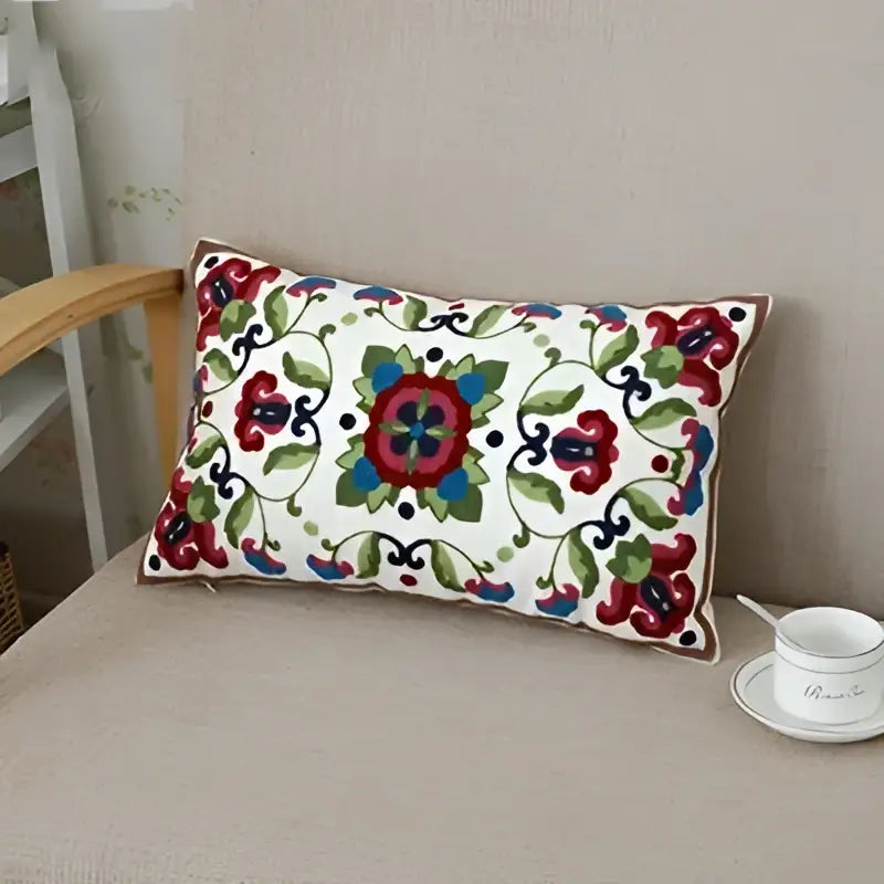 Rectangular white cotton pillow case with intricate red green and blue ethnic floral canvas embroidery for living room decorbites decor