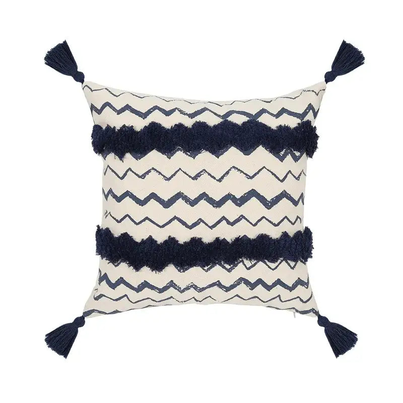 Cream-colored cushion cover with navy ethnic geometric printed zigzag patterns and tassel fringe for living room decorbites