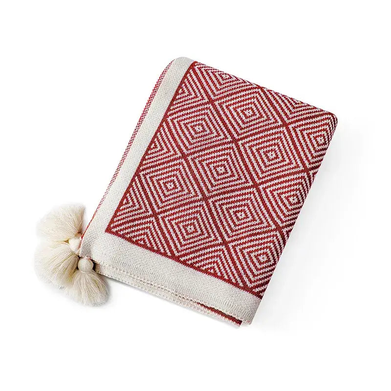 Red and cream ethnic geometry knitted throw blanket with tassels perfect as a living room sofa cover decorbites ethnic geometry