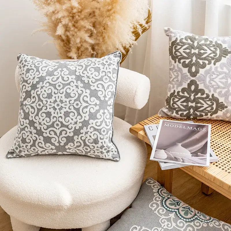 Gray cushion cover with intricate white embroidered decorbites ethnic pattern for living room decor