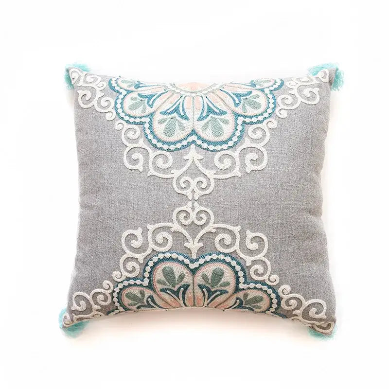 Gray cushion cover with decorbites ethnic pattern embroidery in teal white and peach with light blue tassels for living room decor