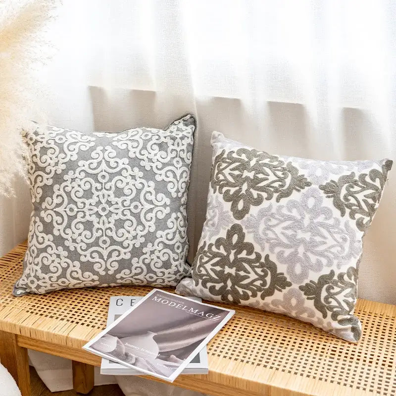 Two square gray and white cushion covers with textured fabric and ethnic pattern for living room decorbites decor