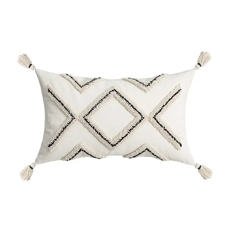 Cream-colored rectangular cushion cover with black geometric embroidery and tassels for decorbites ethnic style black decor