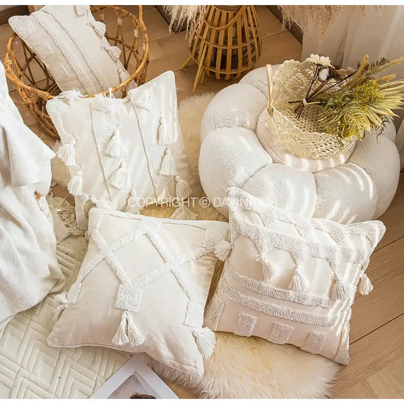 Cream-colored decorbites ethnic tufted cushion case with textured tassels and embroidered geometric patterns for living room decor