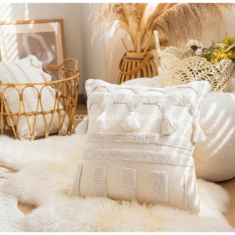 Cream-colored decorbites ethnic tufted cushion case with woven stripes and tassels for living room decor