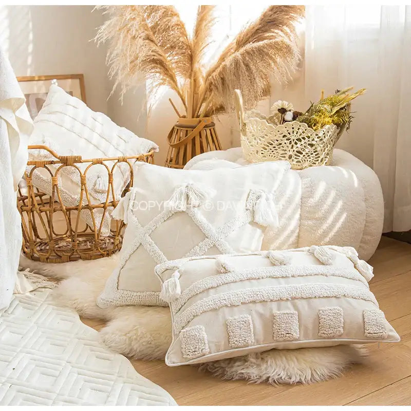 Cream-colored ethnic tufted cushion case with textured tassels and embroidered patches for living room decorbites decor