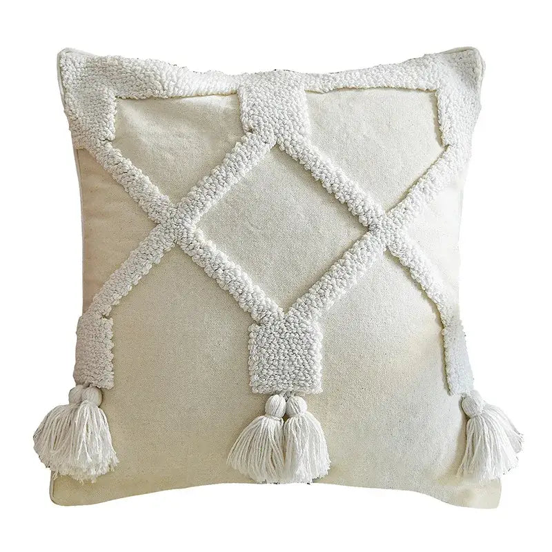 Cream-colored decorbites ethnic tufted cushion case with white woven diamond pattern and tassels for living room decor