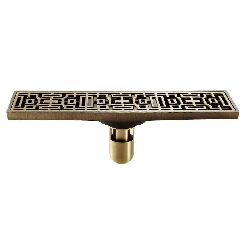 Brass-colored euro antique brass floor drain with intricate geometric lattice pattern and cylindrical mounting base by decorbites