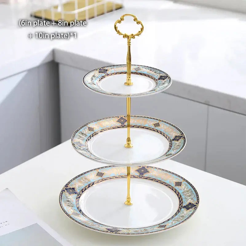 Three-tiered bone china dessert stand with european blue and gold decorative border and ornate gold handle decorbites bone china