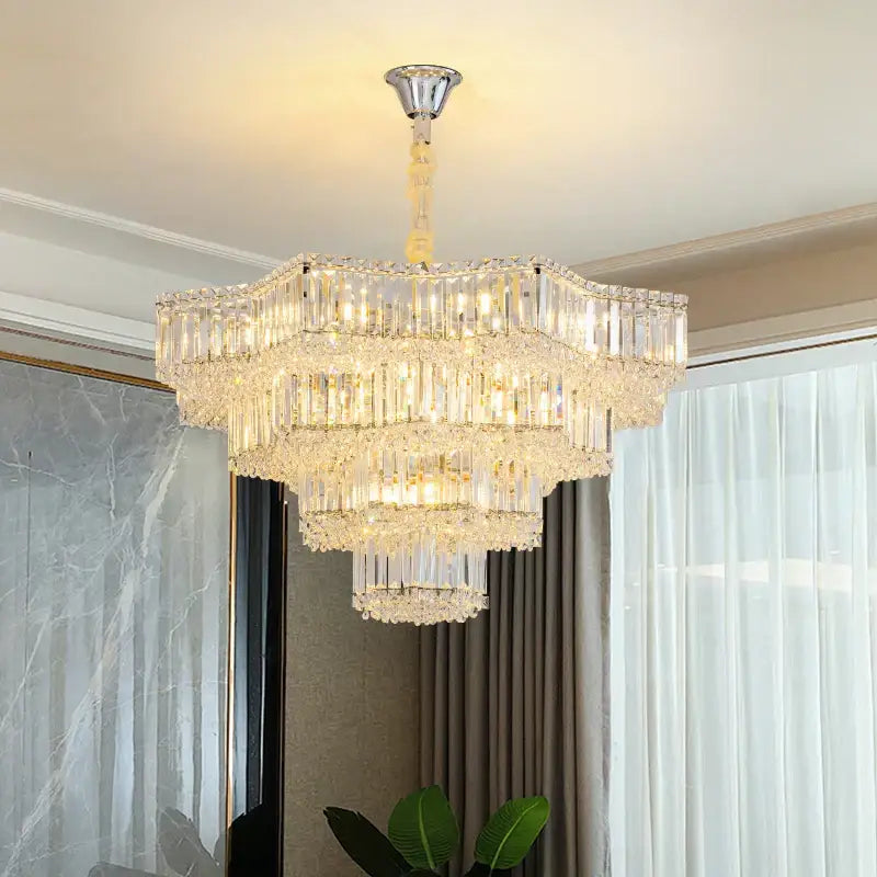 European chrome multi tier light crystal chandelier with cascading prisms emitting warm light for dining room decorbites light crystal