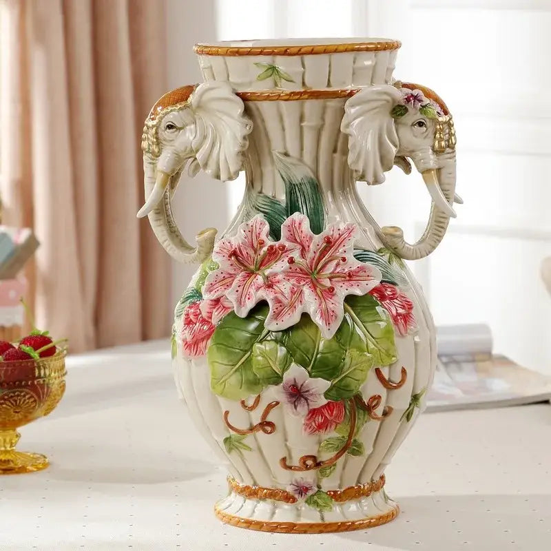 White ceramic elephant vase with pink lily relief flowers green leaves and gold trim for living room decor by decorbites