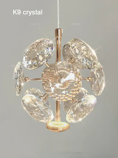 A radiant gold-toned European mini pendant light with polished chrome and faceted k9 crystal discs starburst design