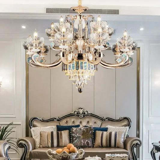 European gold and teal crystal dining room chandelier with ornate gold tone and mosaic accents above a sofa decorbites crystal dining