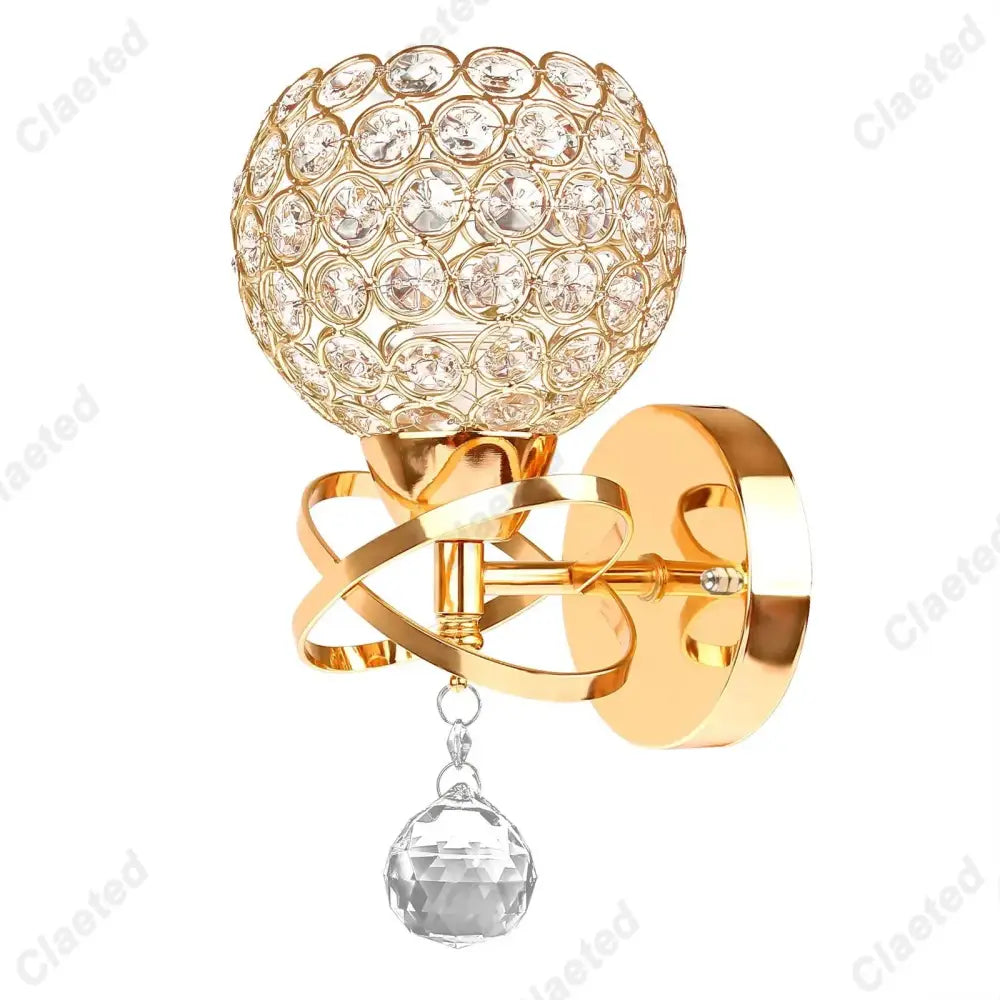 European gold crystal wall light featuring a gold-toned wall sconce with spherical crystal globe and faceted pendant