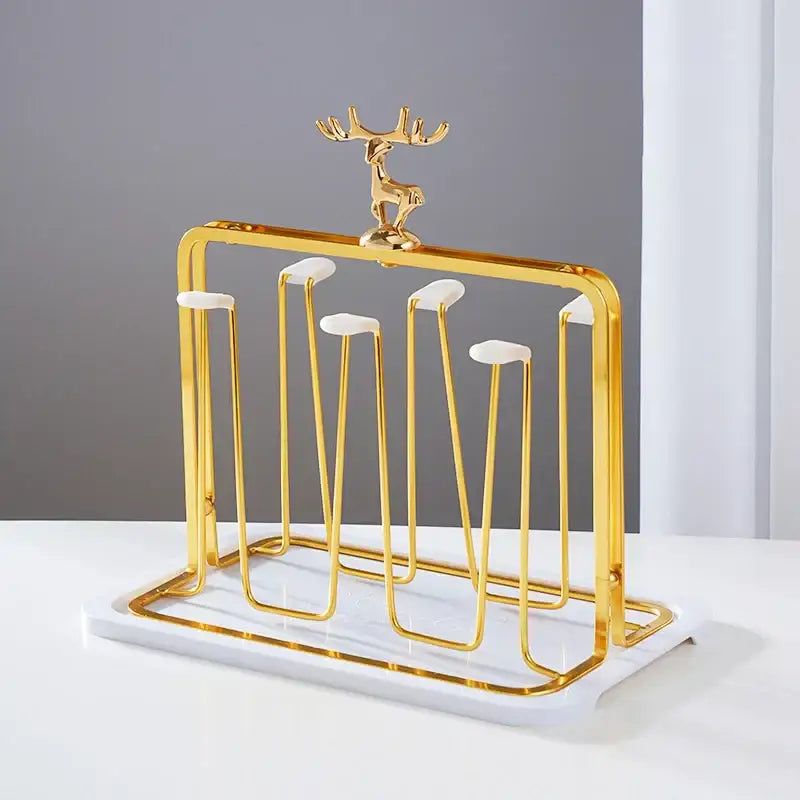 Gold-toned metal cup holder with marble base and decorative deer figurine for european glass storage rack use