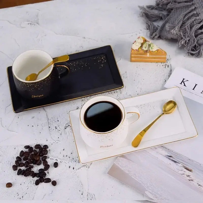 European style black and white ceramic coffee cup set with gold rims and matching rectangular saucers for dining room use