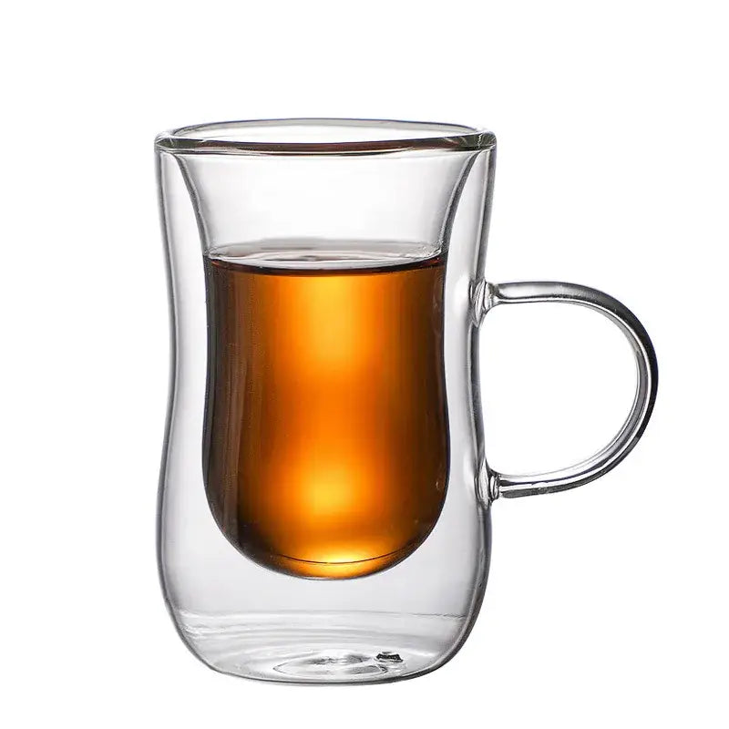 European style clear double glass insulated tea cup with curved handle filled with amber liquid for kitchenware use