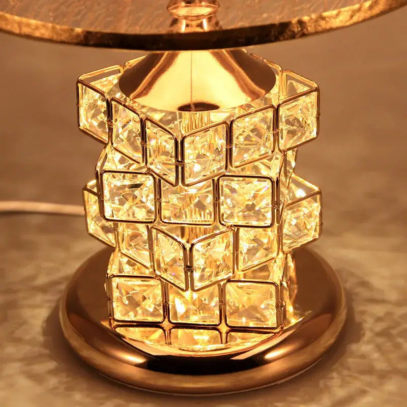 European style gold crystal table lamp with faceted square crystals in a stacked geometric pattern decorbites crystal table lamp