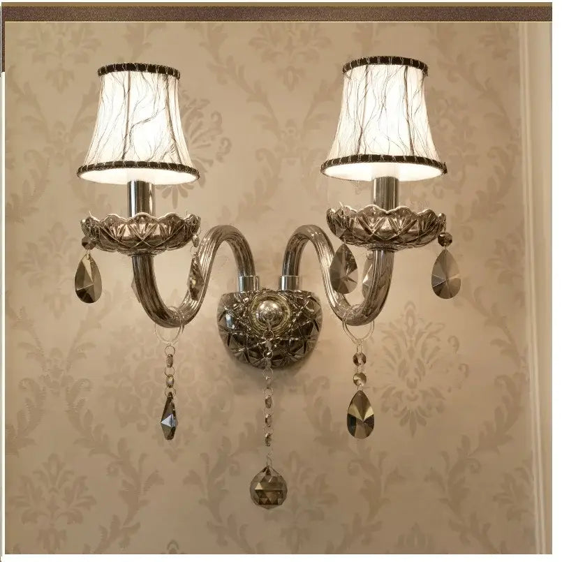 Silver-toned double-arm wall lamp with lace-like lampshades and smoke grey crystal droplets decorbites crystal wall lamp