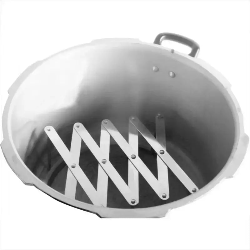 Silver aluminum pressure cooker with collapsible metal rack inside shown with expandable black stainless steel dish drying holder