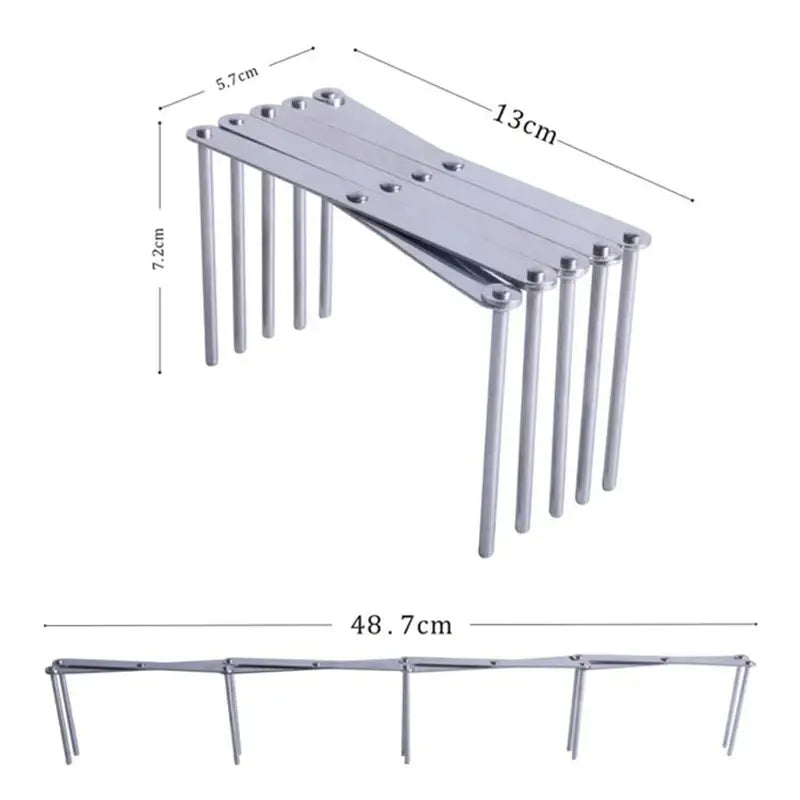 Expandable black stainless steel dish drying holder with silver metallic foldable shelf and minimalist precise engineering design