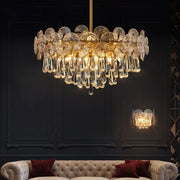 Exquisite golden crystal chandelier with intricate fan-shaped discs and teardrop crystals for living room spaces